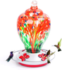 Hummingbird Feeders for Outdoors, 28 Ounces Hand Blown Glass Hummingbird Feeder with Upgraded Leak Proof Round Metal Stand, Wild Bird Feeder for Outside Garden Yard. Ant Moat, Hook and Brush Included